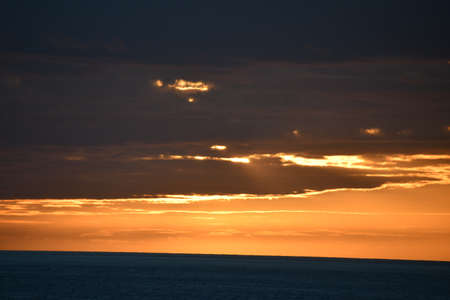Sunset over the Pacific Ocean in Kailua Kona in Hawaiiの写真素材