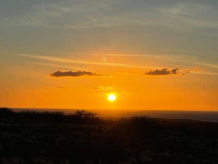 Sunset over the Pacific Ocean in Kailua Kona in Hawaiiの写真素材