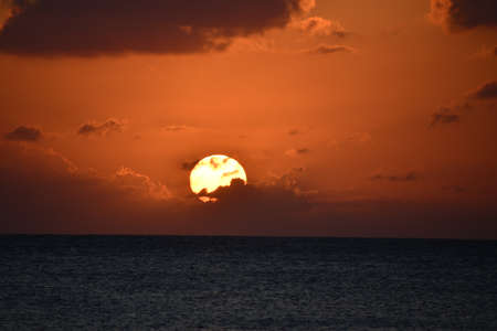 Sunset view from the Seven Mile Beach on Grand Cayman in the Cayman Islandsの写真素材