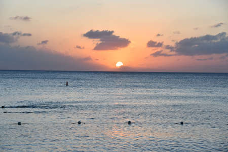 Sunset view from the Seven Mile Beach on Grand Cayman in the Cayman Islandsの写真素材