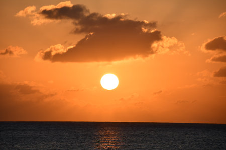 Sunset view from the Seven Mile Beach on Grand Cayman in the Cayman Islandsの写真素材