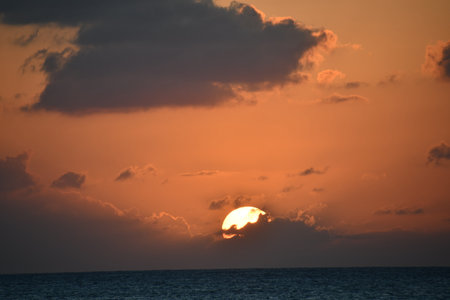 Sunset view from the Seven Mile Beach on Grand Cayman in the Cayman Islandsの写真素材