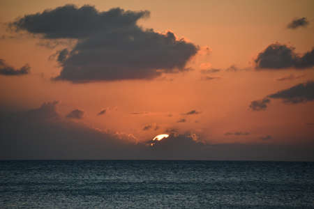 Sunset view from the Seven Mile Beach on Grand Cayman in the Cayman Islandsの写真素材