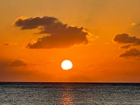 Sunset view from the Seven Mile Beach on Grand Cayman in the Cayman Islandsの写真素材