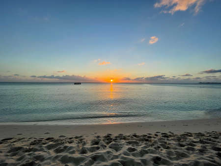 Sunset view from the Seven Mile Beach on Grand Cayman in the Cayman Islandsの写真素材
