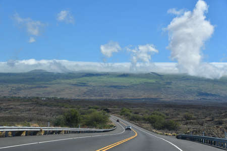 Driving on Kohala Mountain Road at Hawi on the Big Island in Hawaiiの写真素材