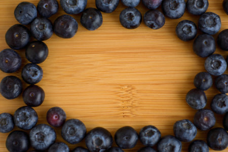 Fresh blueberries on wooden background closeupの写真素材