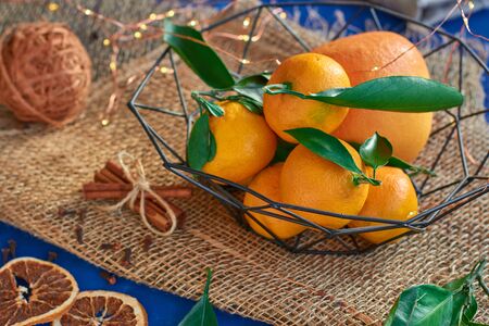 Orange tangerines lie on a wooden boardの写真素材