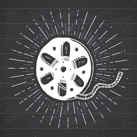 Cinema tape and film reel vintage label, Hand drawn sketch, grunge textured retro badge, typography design t-shirt print, vector illustration on chalkboard background.のイラスト素材