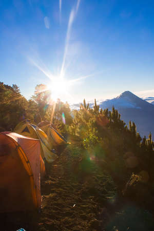 camping area with scenic forest landscape with the volcano and beautiful green forest with blue sky on a beautiful sunny morningの写真素材