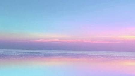 A serene seascape featuring soft pastel hues at dusk. The calm waters reflect gentle colors of the sky, creating a peaceful and tranquil atmosphere.の素材