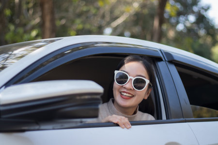 Woman driving out to travel in natureの写真素材