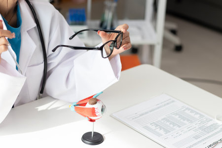 Surgeon with human eye model and explains in modern clinic treatmentの写真素材