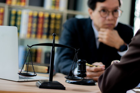 A modern law firm and a male lawyer who is trying to explain the law to women.の写真素材