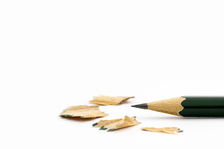 Closeup sharpened pencil shavings on a white background. Suitable for the use of educational articles.の写真素材