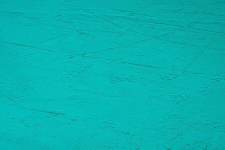 Close up texture of green color painting on cement wall.