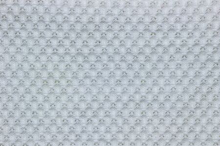 Texture of white shirt fabric. Concept of clothes or fashion.