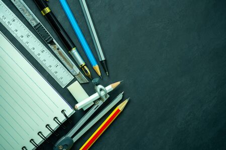 Stationery and notebook on blackboard. Concept of architecture office or back to school. Top view...