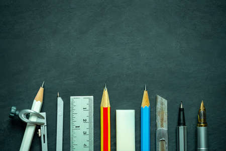 Stationery on blackboard. Concept of architecture office or back to school. Top view and copy space...