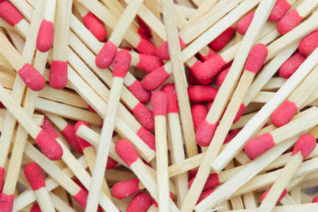 Closeup texture background of many the match stick is stacked in bright light. Top view and copy...