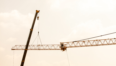 The construction crane on sunset の写真素材