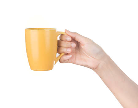 Hand holding mug isolated on white の写真素材