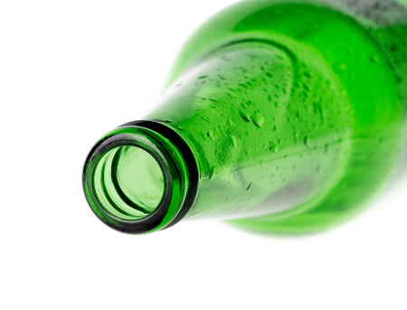 beer in a green bottle isolated on a white の写真素材