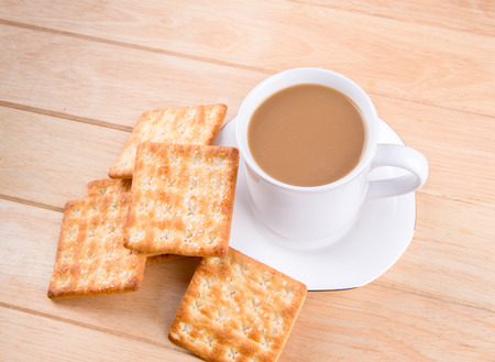 Coffee cup on the table with bread sticks の写真素材