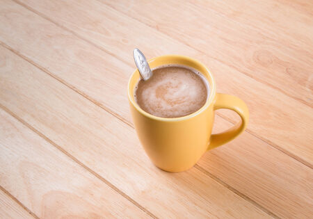Coffee cup on wooden tableの写真素材