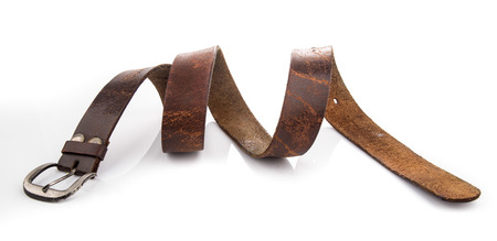 Old Leather Belts isolated on white backgroundの写真素材