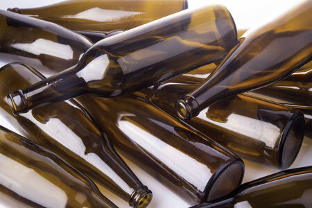 Pile of beer bottle on white backgroundの写真素材