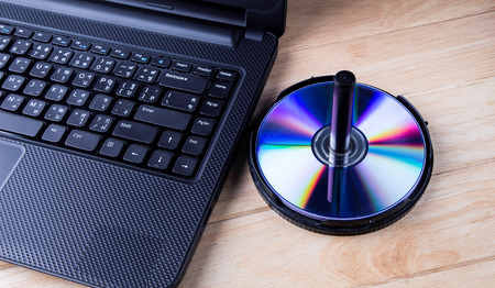 Laptop with dvd disk の写真素材