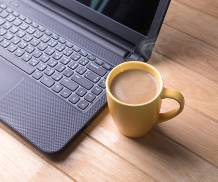Coffee cup with the computer の写真素材