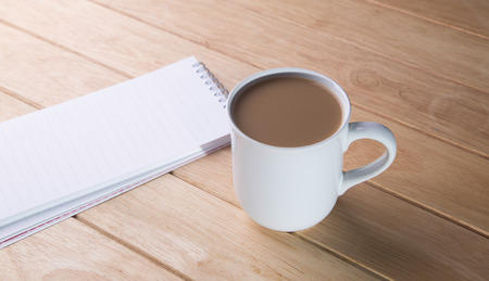 coffee cup with notebooks の写真素材