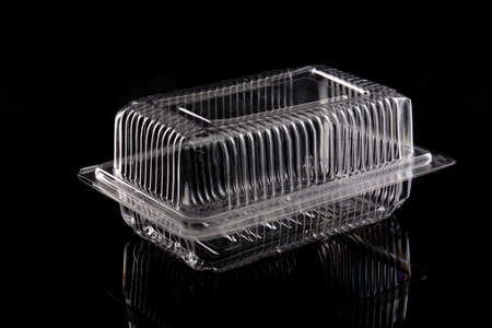 Transparent plastic box on black background の写真素材