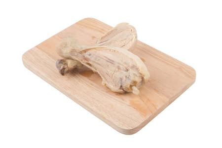 Place the cooked chicken on a wooden cutting board の写真素材