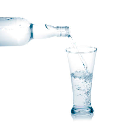 Pour into a glass isolated on a white background 