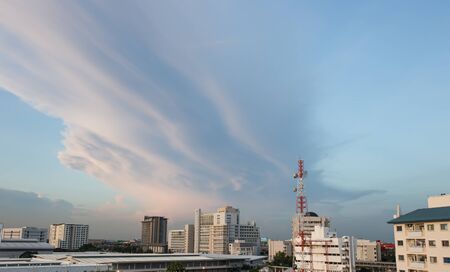 Cloudy with the city sunset.の写真素材