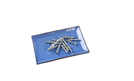 screw in plate food on a white background.Eat bolts for body repair, Concept.の写真素材