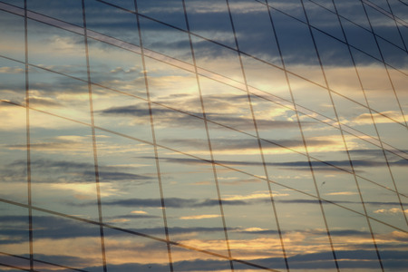 Glass of modern tower, sunset reflection beautiful.の写真素材