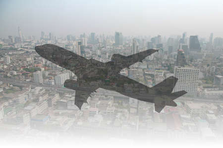 Airplane shadow over the city - Travel concept.の写真素材