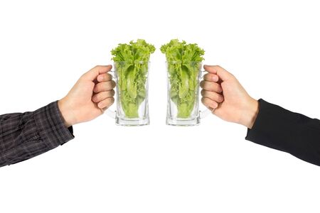 ettuce green in glass water in a hand isolated   on white background.の写真素材