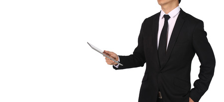 Business man holding a touch screen pad isolated on a white background.の写真素材
