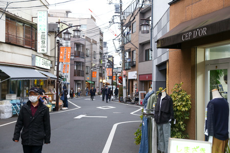 TOKYO, JAPAN - March 13, 2017: People walking at Yanesen market the ancient trading district of Japan - Evening light concept.のeditorial素材