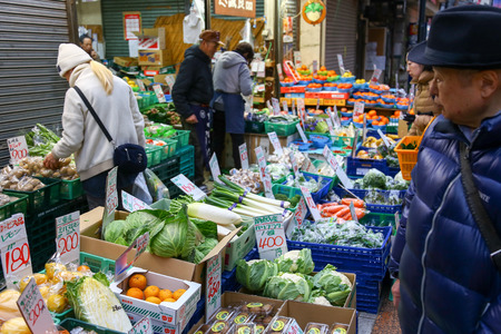 TOKYO, JAPAN - March 13, 2017: Vegetable shop at Yanesen market the ancient trading district of Japan - Evening light concept.のeditorial素材