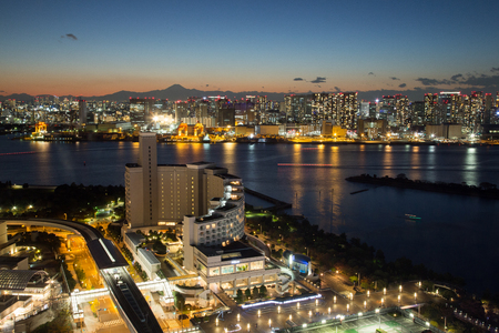 Tokyo, JAPAN - November 19 ,2017 : See night cityscape and Mount Fuji from Fuji TV Building at Odaiba in sunset.のeditorial素材