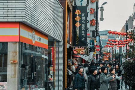 Yokohama, Japan - November 20, 2018 : Tourists are walking, shopping and eating in Chinatown at YOKOHAMA, JAPAN. Cinema tone concept.のeditorial素材