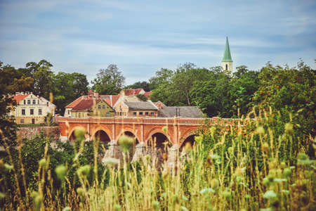 Old bridge over the riverの写真素材