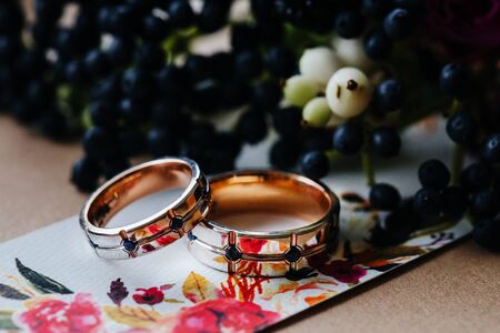 Wedding rings arranged on the invitation card. Wedding card, Valentine's Day greeting.の写真素材