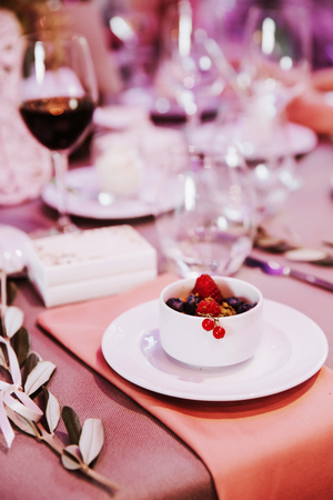Dessert with red berries served in a restaurant.の写真素材